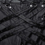 Close-up of Mordanthe Trousers featuring black fabric and unique strap design with eyelets for a bold look.