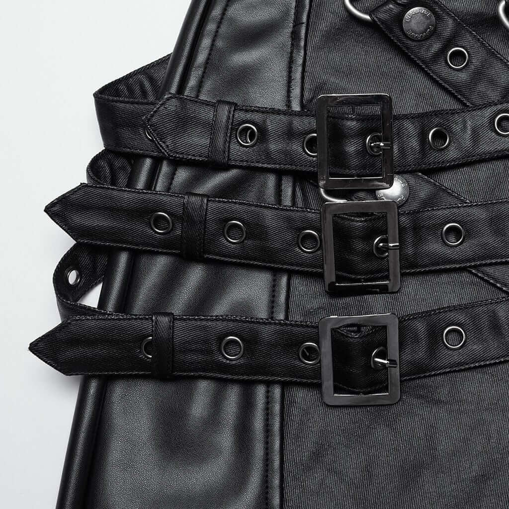 Close-up of Mordanthe Trousers featuring black straps and buckles, showcasing unique design elements.