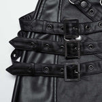 Close-up of Mordanthe Trousers featuring black straps and buckles, showcasing unique design elements.