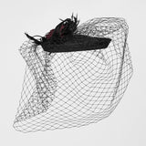 Mourning Star Veil Fascinator Hat in Black & Red