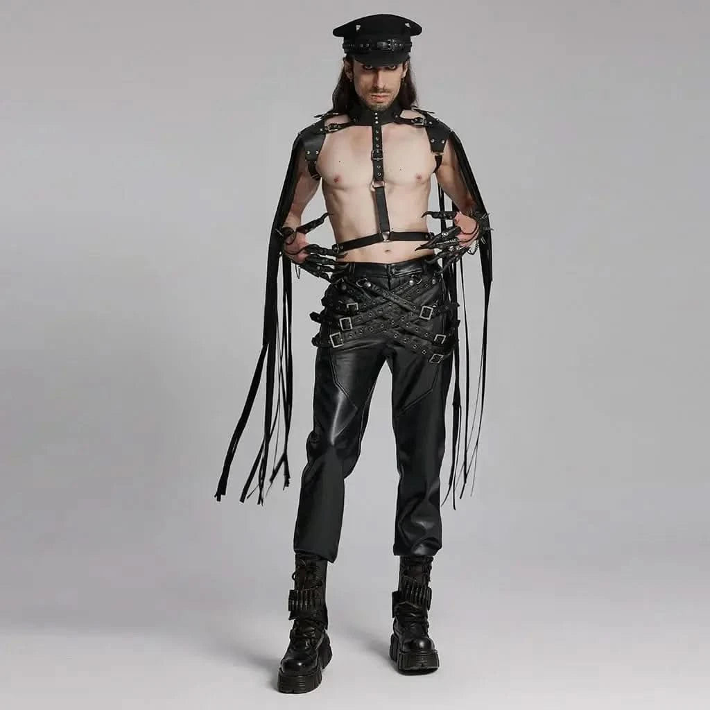 Model wearing Mordanthe Trousers, showcasing a bold, edgy style with harness and leather details.
