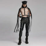 Model wearing Mordanthe Trousers, showcasing a bold, edgy style with harness and leather details.